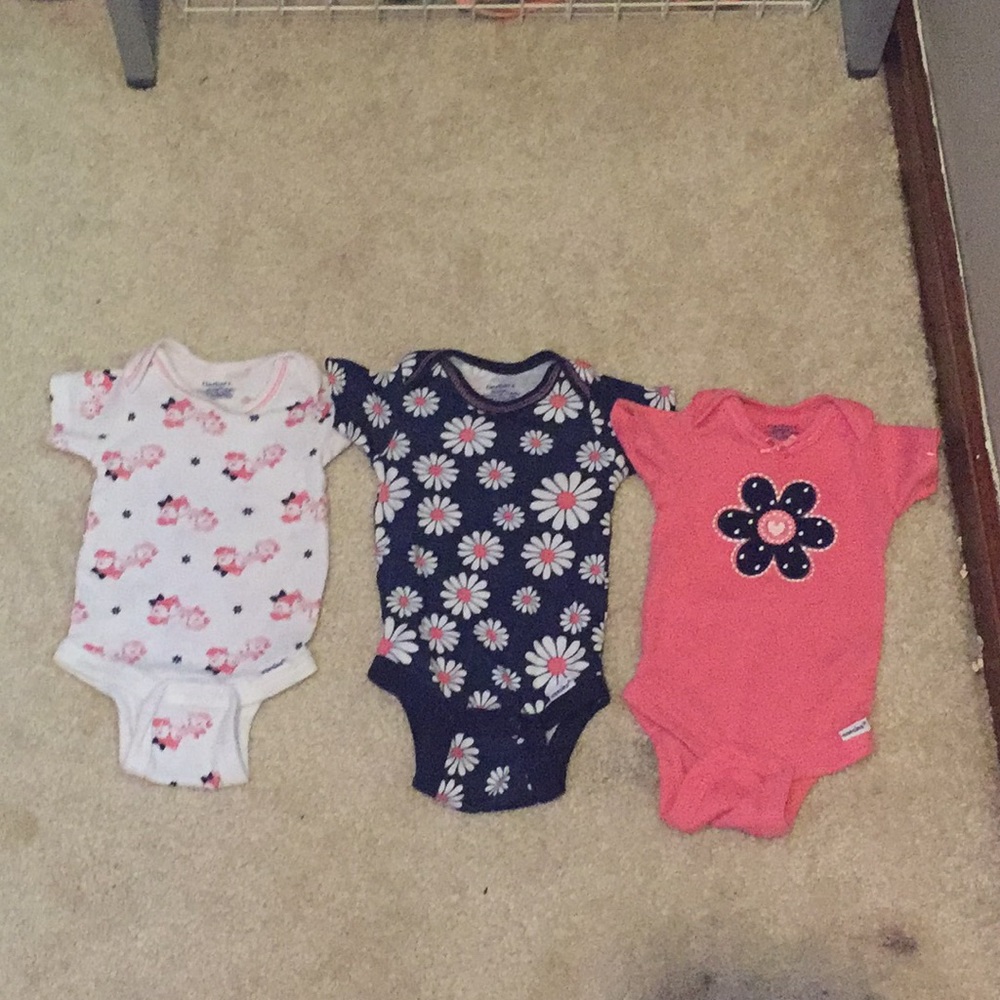 Three sets of a Gerber onesies
